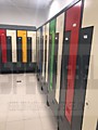 Вместительные шкафы с Г образными дверями в раздевалке предприятия